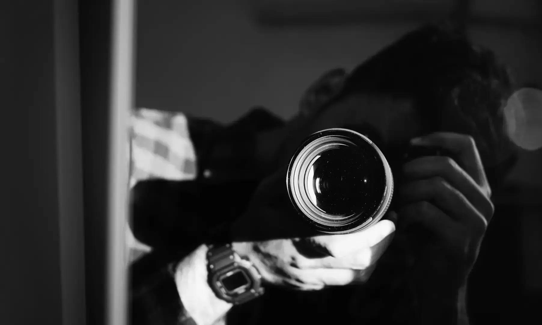 Photographer holding a camera in the Safe Frame Black Friday 2026 promotion