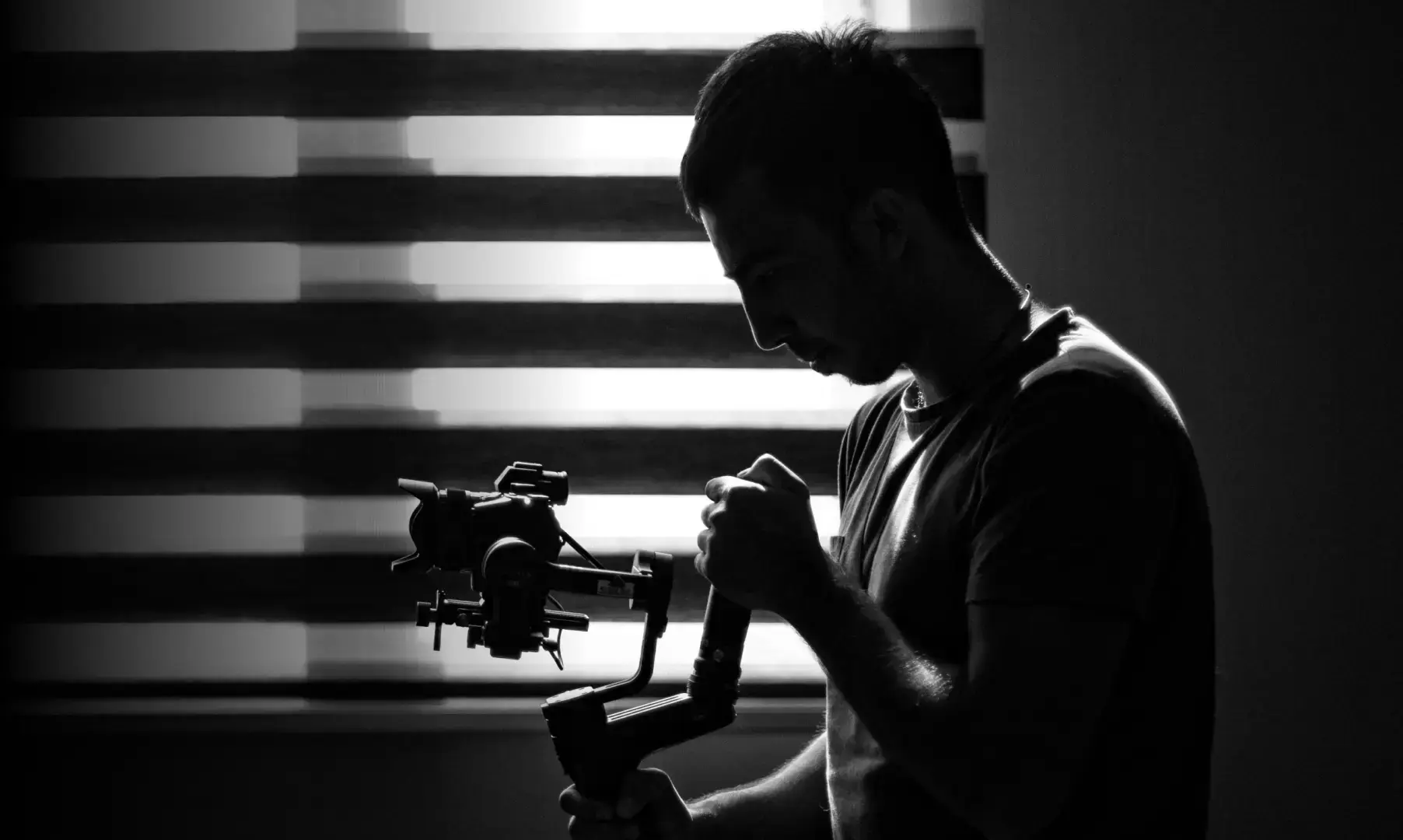 Photographer adjusting a camera for the Safe Frame Black Friday 2026 campaign
